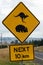 â€˜Kangaroo and Wombat Crossing. 10kmâ€™ sign in Australia