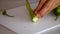 â€‹ Prepare cooking by chopping vegetable in the kitchen