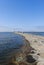 ÅšwinoujÅ›cie, Poland - June 2018: Windmill, lighthouse on the breakwater