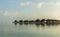 Ð’eautiful wooden villas, standing on stilts in the turquoise water of the Indian Ocean, Maldives