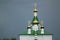 Ð—Ð¾Golden Church domes against the dark stormy sky