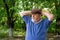 Ð—ortrait of bearded senior man resting in tree shadow