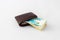 Ð’rown leather wallet and stack of banknotes new Israeli shekels on white background