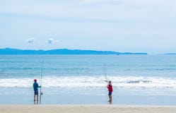 2 Young Boys Fishing At The Beach Stock Photos
