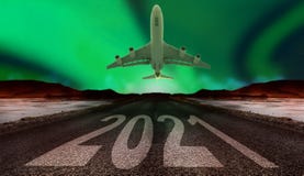 2021 New Year Celebration On The Asphalt Road With A Plane On A Northern Light Stock Photography