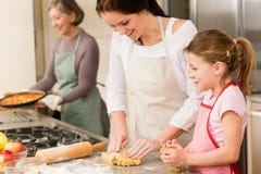 3 Generations Of Women Baking Apple Pies Stock Photos 3 Generations Of Women Baking Apple Pies Stock Photos