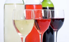 3 Wine Bottles And Glasses Royalty Free Stock Photo