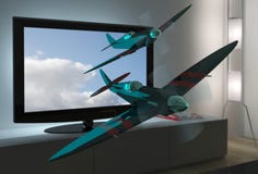 3D TV With Spitfire Airplanes Flying Out Stock Photos