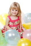 4 Year Old Girl Sitting with Balloons royalty free stock images 4 Year Old Girl Sitting with Balloons royalty free stock images