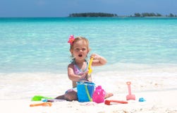 A Baby Girl On The Beach Stock Photo