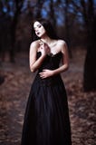 A Beautiful Sad Goth Girl Stands In Grove Royalty Free Stock Image