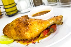 A Big Chicken Leg- Roasted With Red Peppers Royalty Free Stock Photos