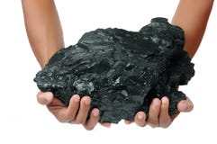 A Big Lump Of Coal Is Held With Two Hands Stock Images