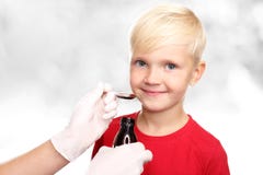 A Delicious Syrup, The Boy Drink A Cure For The Common Cold. Stock Photos A Delicious Syrup, The Boy Drink A Cure For The Common Cold. Stock Photos