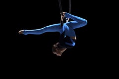 A Female Gymnast Performing Exercises On An Air Ring Hoop Royalty Free Stock Photo