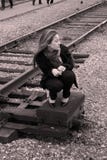 A Girl Sitting Near Railroad Royalty Free Stock Photography