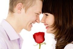 A Guy And A Girl Holding A Rose And Look At Each Other Royalty Free Stock Photos