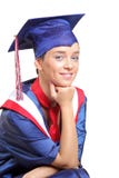 A Happy Graduating Student Wearing Cap And Gown A Happy Graduating Student Wearing Cap And Gown