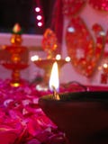 A Lit Diya On Bed Of Roses Royalty Free Stock Image