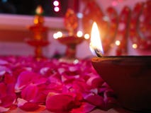 A Lit Diya On Bed Of Roses Royalty Free Stock Photography