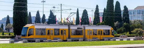 A Modern Tram Ride Down The City Street. Transport System For Passengers In A European City Stock Images A Modern Tram Ride Down The City Street. Transport System For Passengers In A European City Stock Images