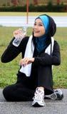 A Pretty Muslim Woman Athlete Resting While Drink Royalty Free Stock Photo A Pretty Muslim Woman Athlete Resting While Drink Royalty Free Stock Photo