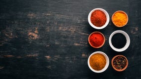 A Set Of Spices And Herbs. Indian Cuisine. Pepper, Salt, Paprika, Basil, Turmeric. Stock Images A Set Of Spices And Herbs. Indian Cuisine. Pepper, Salt, Paprika, Basil, Turmeric. Stock Images