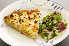 A Slice Of Quiche With Leek And Feta Or Goats Cheese On A Plate With Crispy Leaf Green Salad. Vegetarian Food Image Close Up Stock Photography
