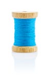 A Small Wooden Bobbin With Blue Thread Stock Photography A Small Wooden Bobbin With Blue Thread Stock Photography