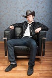 A Stylish Man Sitting In Leather Chair Stock Images