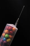 A Syringe Filled With Candy Stock Image