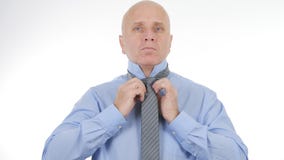 Businessman Arranging His Knot Tie Before a Business Meeting stock photography Businessman Arranging His Knot Tie Before a Business Meeting stock photography