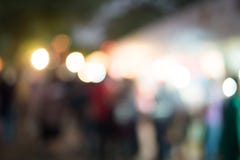 Abstract blur image of food stall at night festival with bokeh for background usage