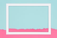 Abstract geometrical pastel blue and pink colored paper flat lay background. Minimalism template with empty picture frame. stock photography Abstract geometrical pastel blue and pink colored paper flat lay background. Minimalism template with empty picture frame. stock photography