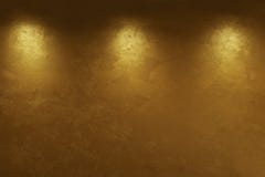 Abstract gold background with three light points