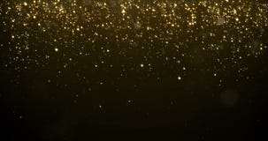 Abstract gold particles glitter light falling bokeh glare effect. Shimmering texture of glittering golden light rain glow for luxu