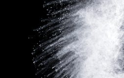 abstract powder explosions isolated on black background. stock photo abstract powder explosions isolated on black background. stock photo