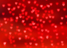 Abstract red background with red heart shaped bokeh lights Stock Photo Abstract red background with red heart shaped bokeh lights Stock Photo
