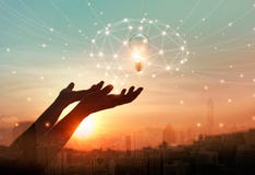 Abstract science. Hand holding brain digital network and light bulb inside on networking connection in the city background. vector illustration Abstract science. Hand holding brain digital network and light bulb inside on networking connection in the city background. vector illustration