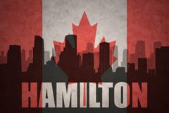 Abstract silhouette of the city with text Hamilton at the vintage canadian flag vector illustration Abstract silhouette of the city with text Hamilton at the vintage canadian flag vector illustration