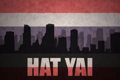 Abstract silhouette of the city with text Hat Yai at the vintage thailand flag stock images Abstract silhouette of the city with text Hat Yai at the vintage thailand flag stock images