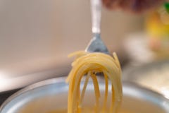 Abstract spaghetti background in boiling broth on fork close up royalty free stock image Abstract spaghetti background in boiling broth on fork close up royalty free stock image
