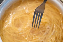 Abstract spaghetti background in boiling broth on fork close up royalty free stock photo Abstract spaghetti background in boiling broth on fork close up royalty free stock photo