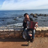 Accordian Player by the Sea royalty free stock image Accordian Player by the Sea royalty free stock image