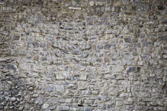Achtergrond textuur van de middeleeuwse muur van de kasteelsteen stock fotografie Achtergrond textuur van de middeleeuwse muur van de kasteelsteen stock fotografie