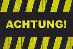 Achtung! в немце, внимание! слово написанное на предупредительном знаке Стоковая Фотография RF Achtung! в немце, внимание! слово написанное на предупредительном знаке Стоковая Фотография RF