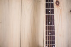 Acoustic guitar neck on wooden background with strings royalty free stock photos Acoustic guitar neck on wooden background with strings royalty free stock photos