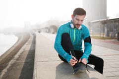 Handsome sportsman training jogging and exercising outdoor Stock Photos Handsome sportsman training jogging and exercising outdoor Stock Photos