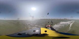 360 degrees, a man in a helmet with a camera is riding the sea, people are kitesurfing stock video footage 360 degrees, a man in a helmet with a camera is riding the sea, people are kitesurfing stock video footage
