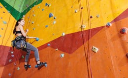 Active Woman Climbing Up The Wall In Gym Royalty Free Stock Photos Active Woman Climbing Up The Wall In Gym Royalty Free Stock Photos